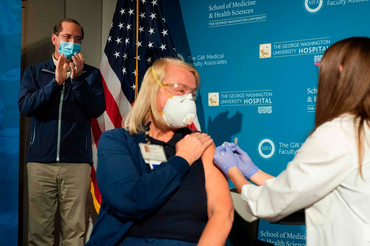 US Covid-19 deaths top 300,000 on day major vaccination campaign launched