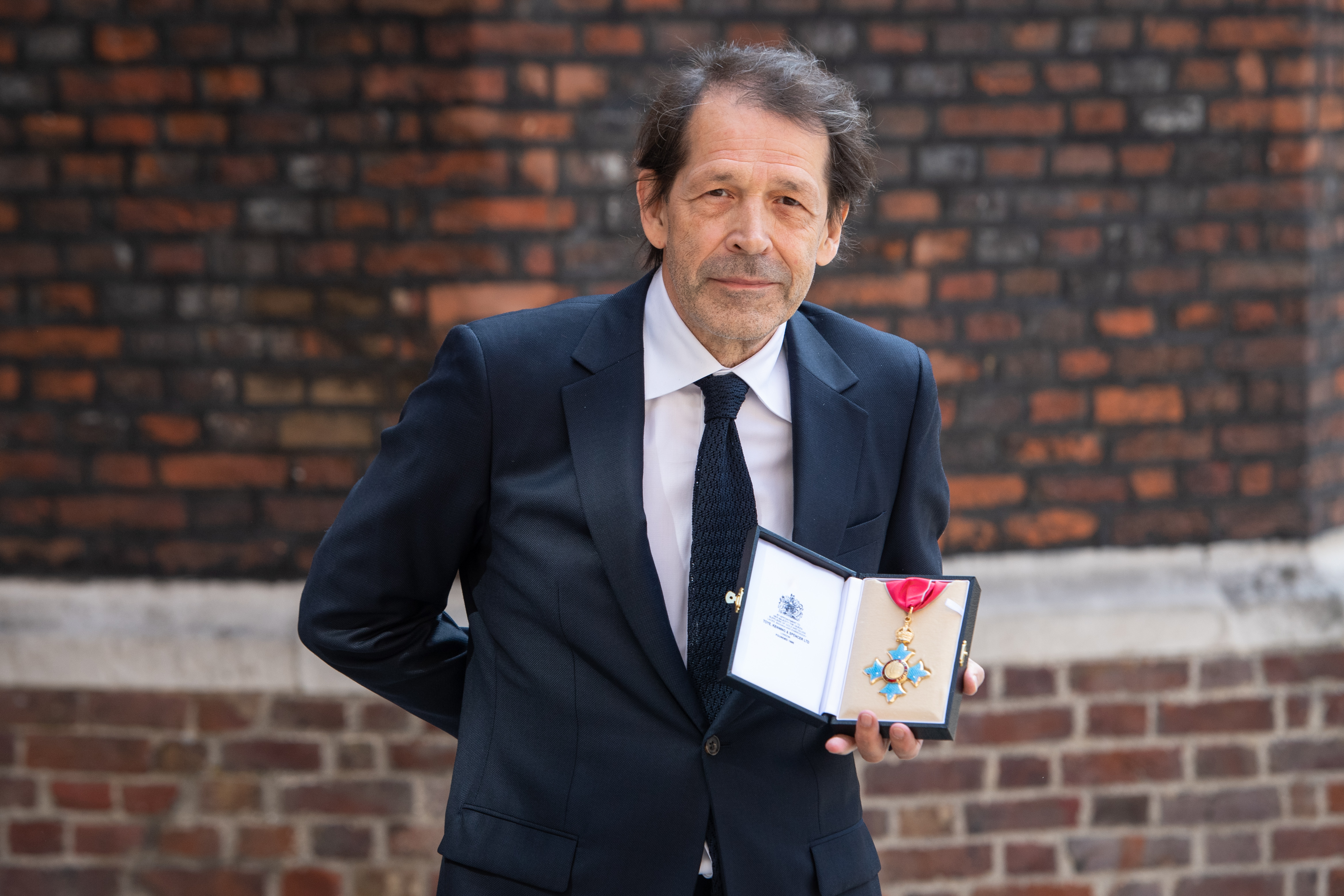 Factory Records co-founder Peter Saville honoured with CBE for decades of design
