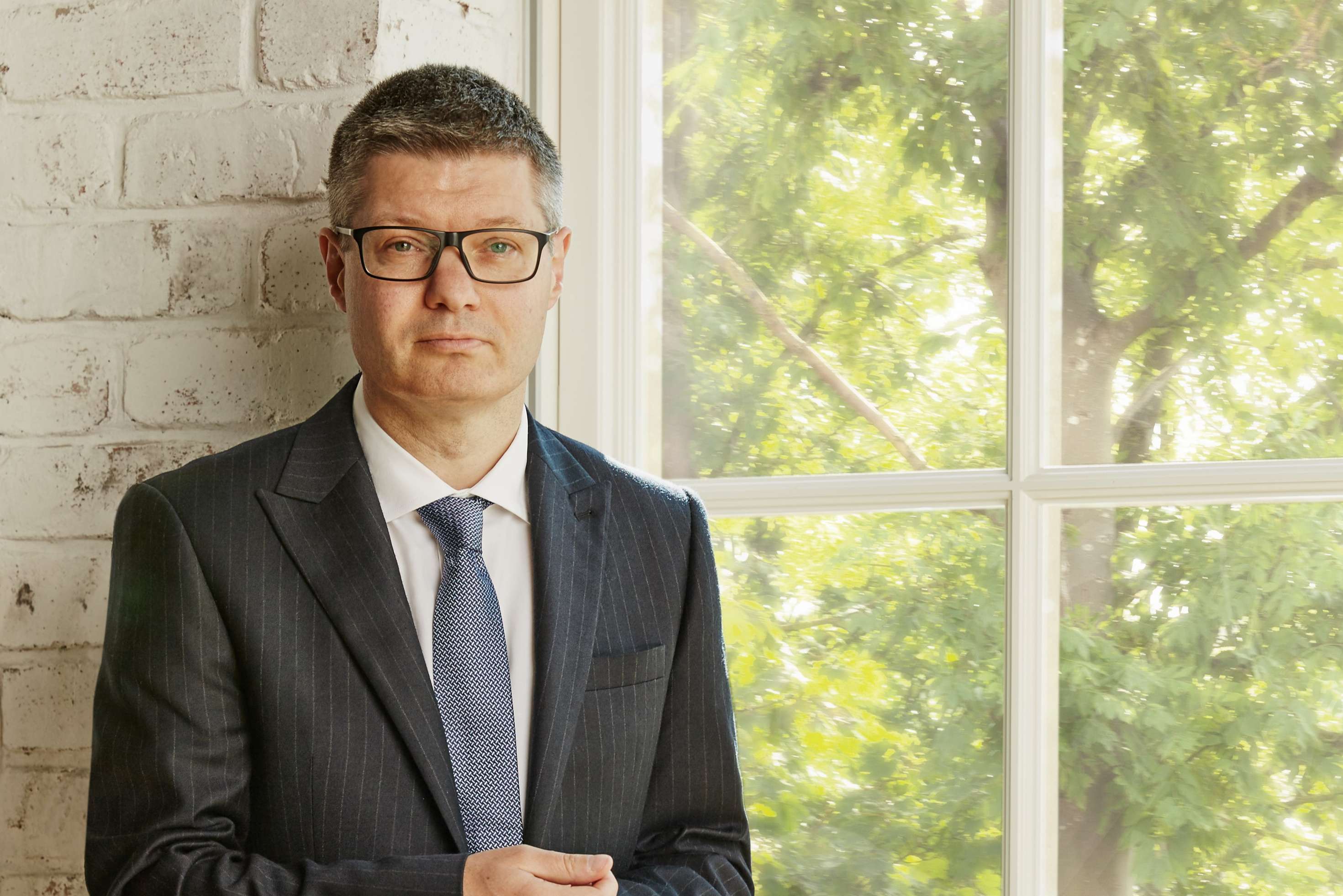 Next targets more takeovers as it defies economic turmoil