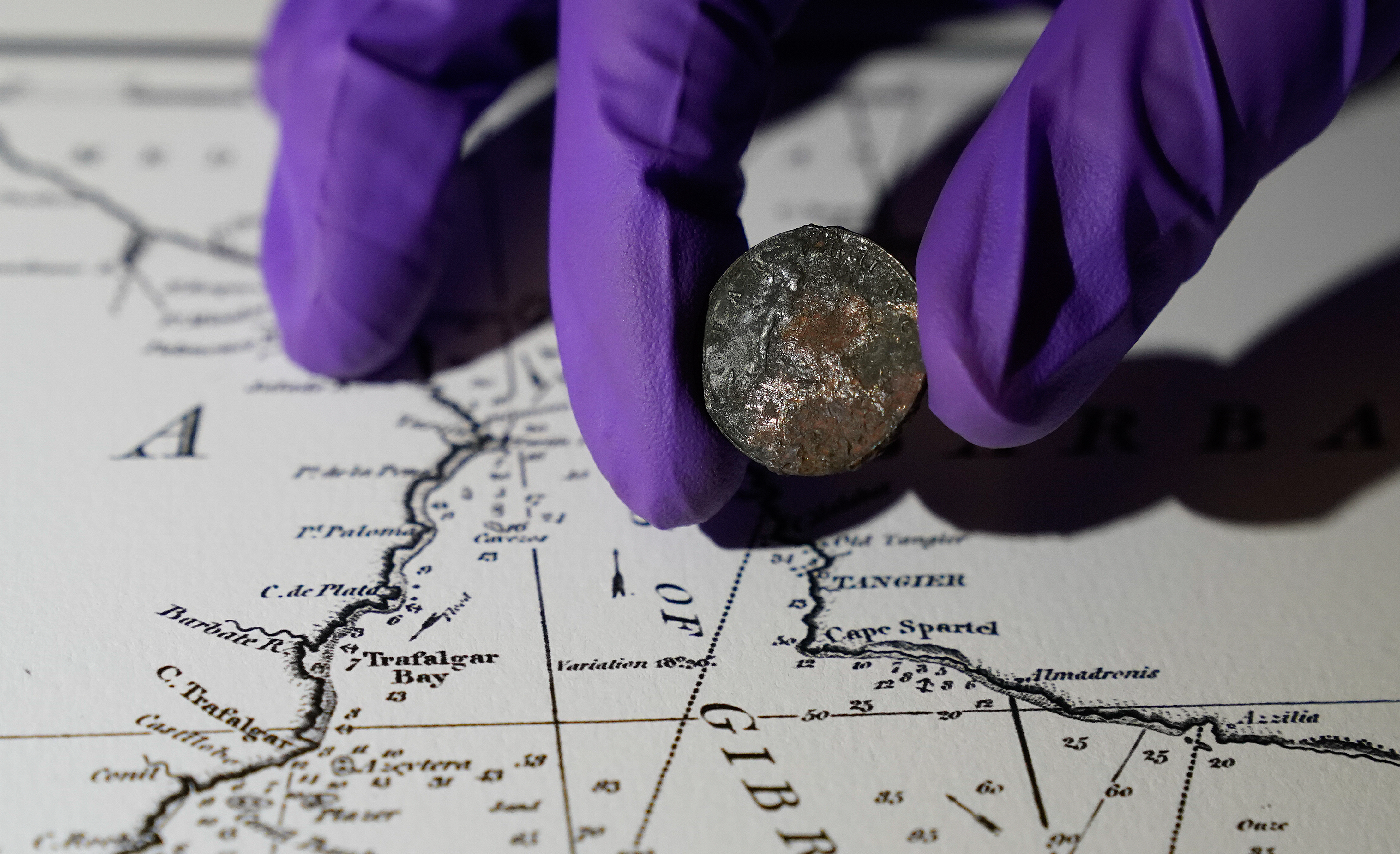 Conservation workers find 127-year-old coin in HMS Victory
