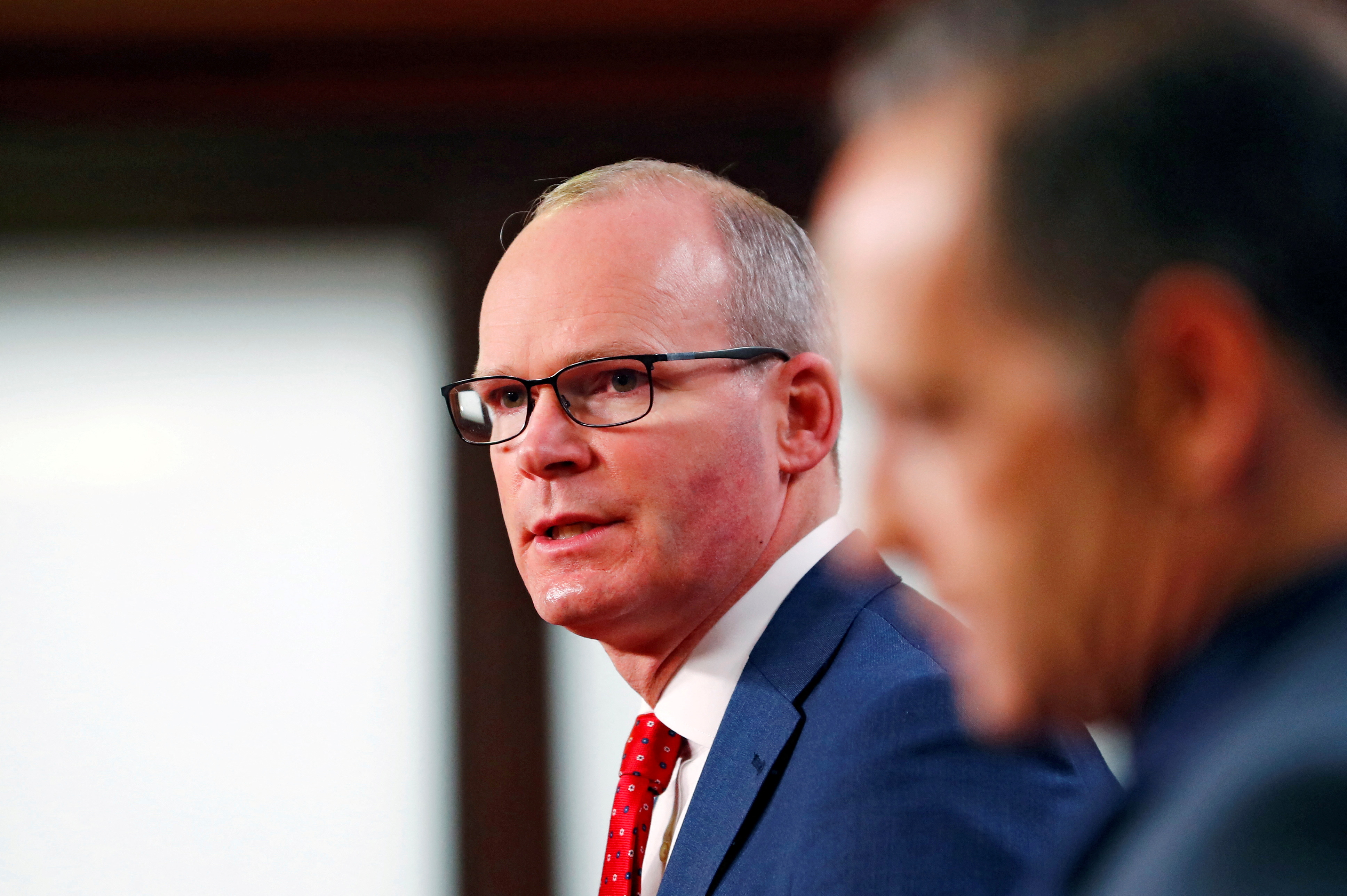 Irish foreign minister taken off stage in Belfast amid security alert