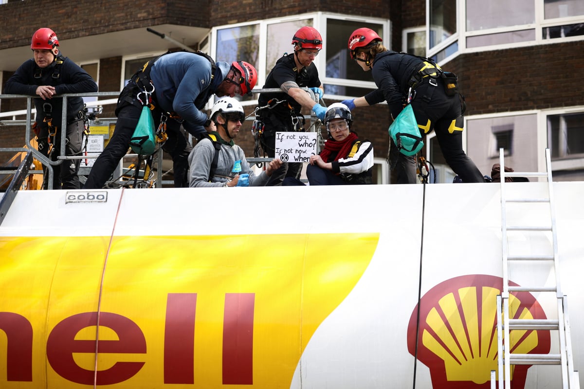 Extinction Rebellion activists arrested after Olympians climb on oil tanker