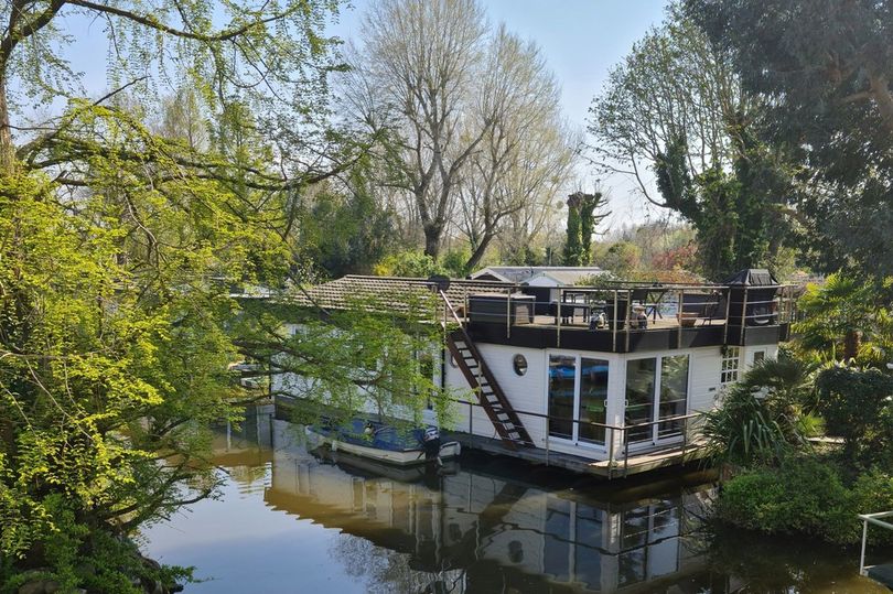 Rare floating home moored to River Thames island for sale for £545,000