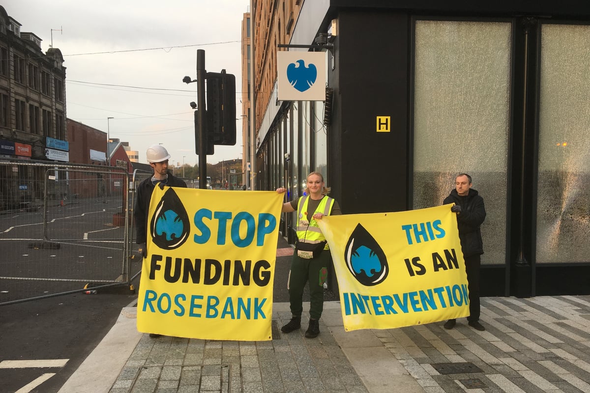 Climate activists smash glass of Glasgow bank