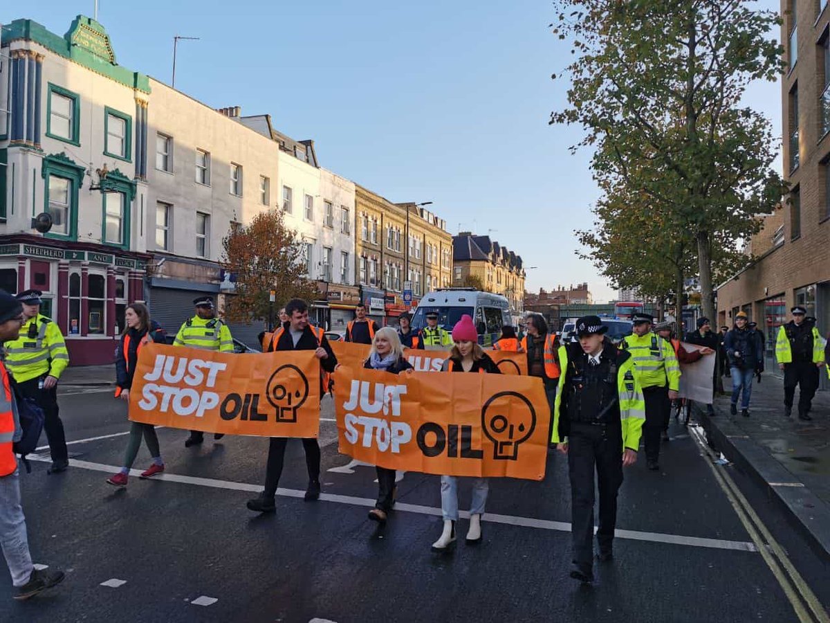 Just Stop Oil protesters slow traffic as they march from Moorgate to London Wall