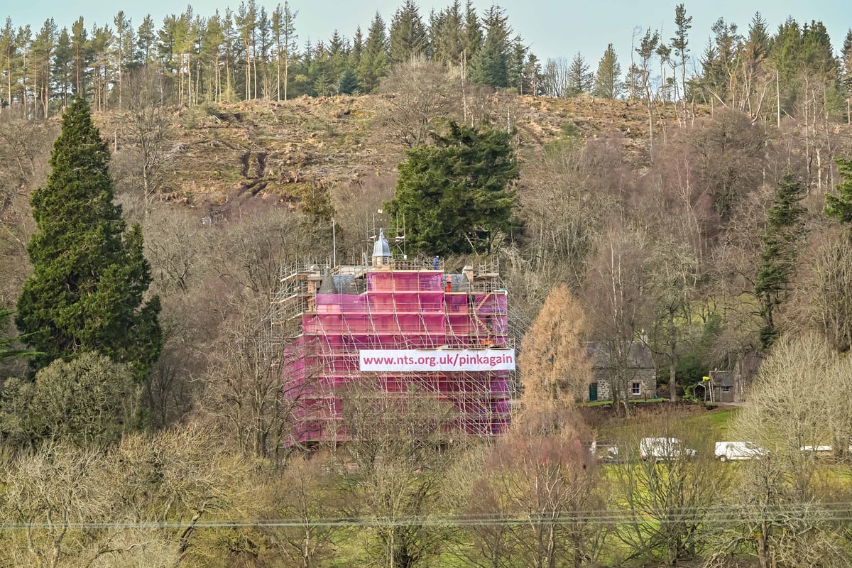 Castle swathed in seven-storeys of pink mesh for conservation work