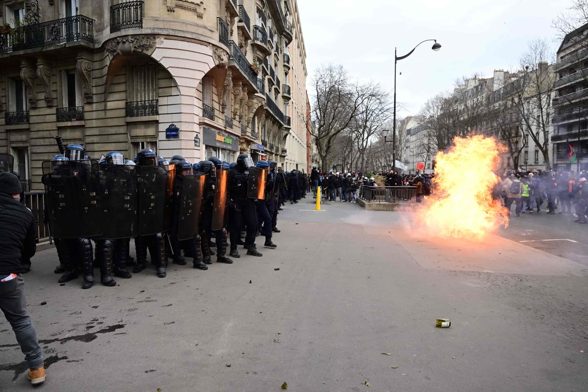 Violence erupts in Paris as thousands take to streets to protest pension reforms