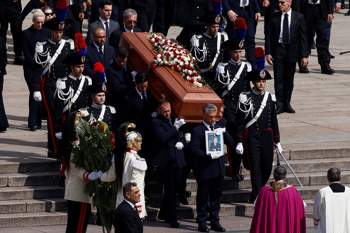 Mourning crowds chant name of Silvio Berlusconi at his Milan state funeral