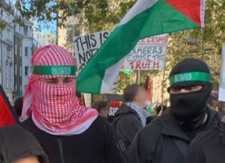 Met appeal to find men who wore Hamas-style headbands on march