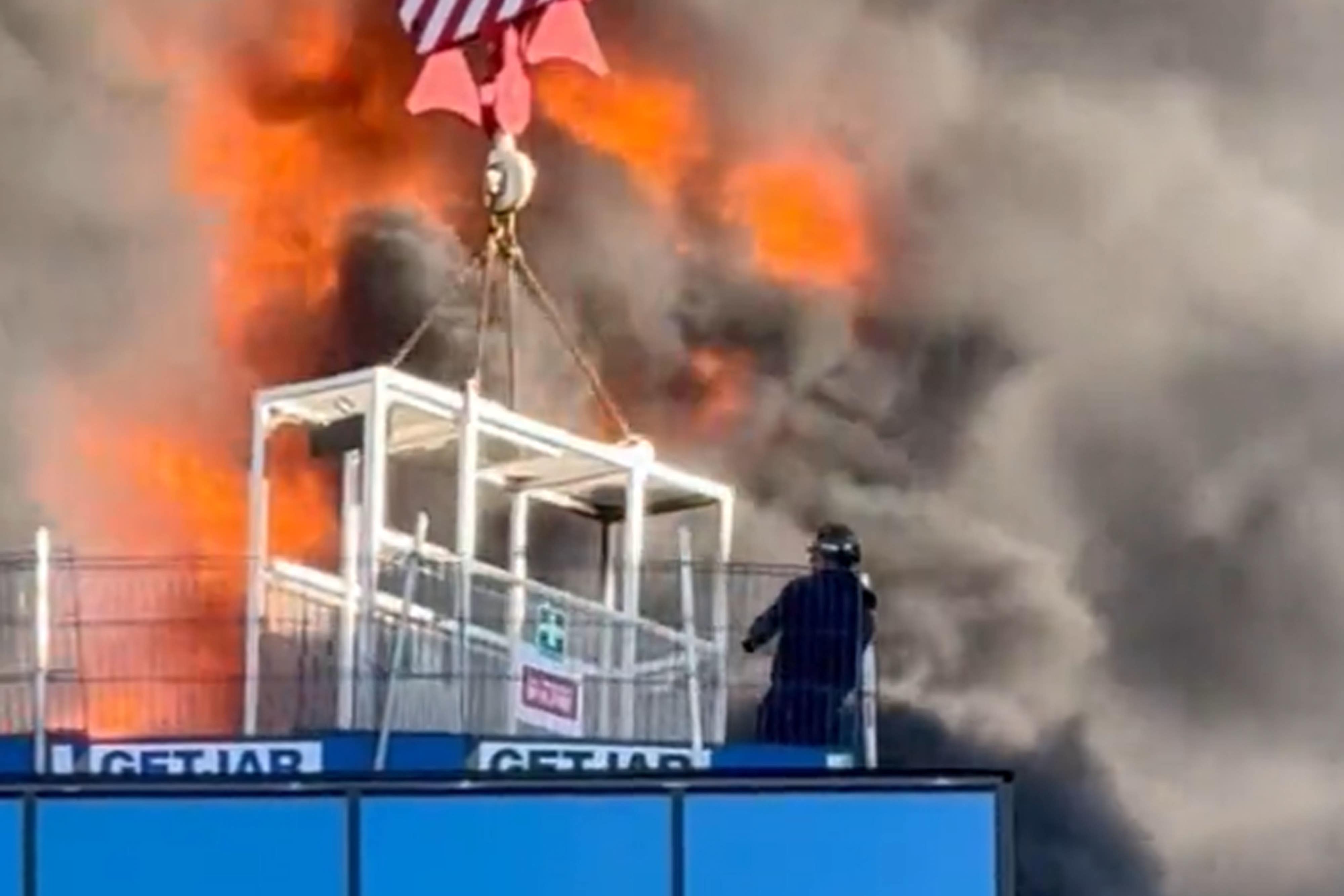 Crane worker praised for rescuing man from burning building