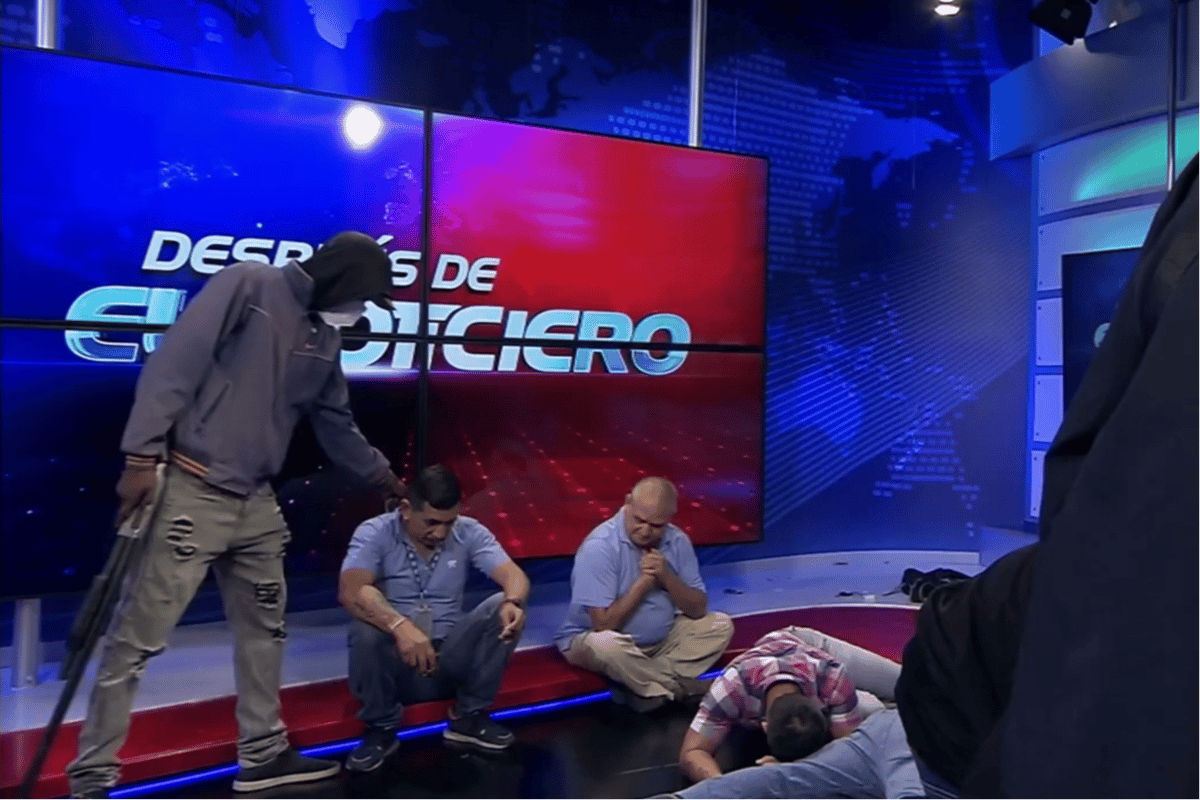 Ecuador on brink of civil war as masked gunmen storm TV studio and gangs threaten executions