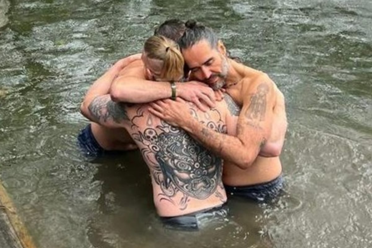 Russell Brand shares new picture embracing Bear Grylls during River Thames baptism