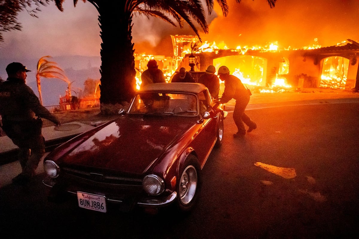 California wildfires force thousands to evacuate as homes go up in flames
