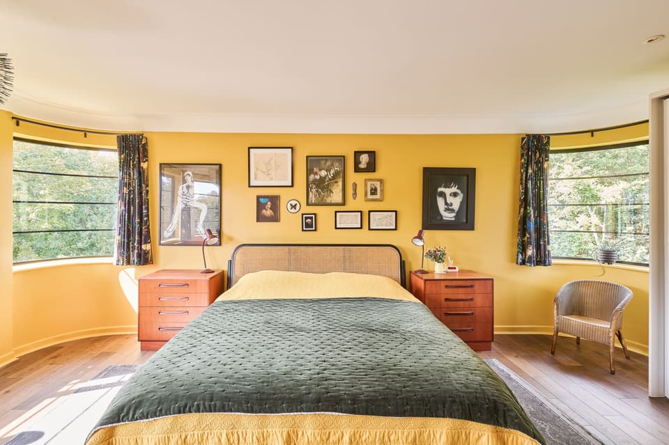 At first, Gavriel tried painting the bedroom grey - before opting for yellow