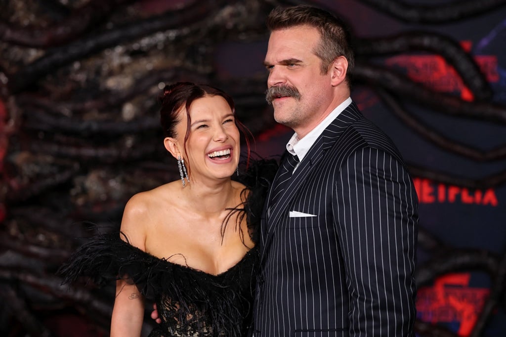 David Harbour and Millie Bobby Brown all smiles at Stranger Things red premiere amid 'bullying' claims