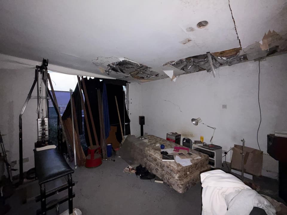 The house has three bedrooms, all with holes in the ceilings