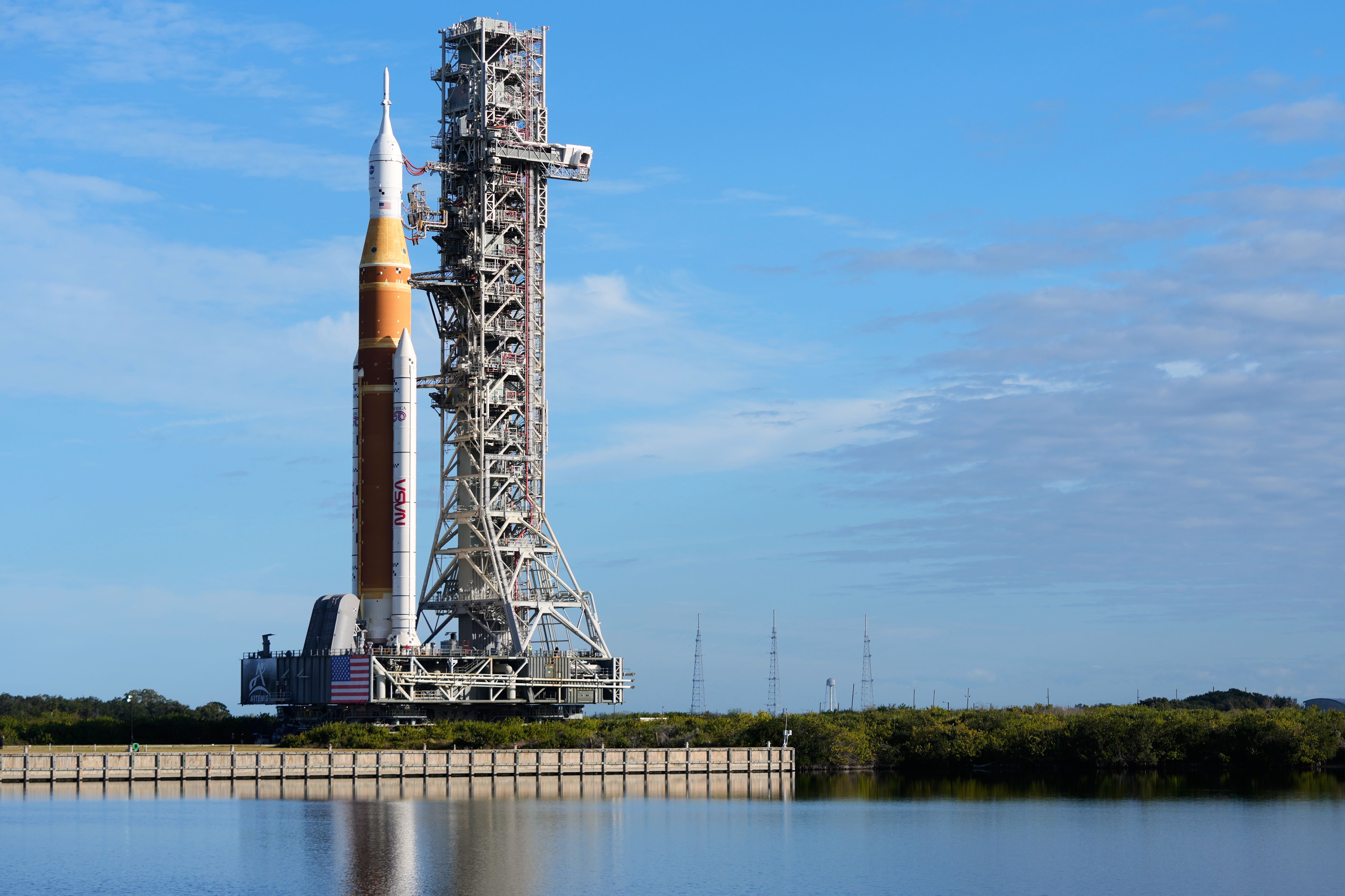 Nasa rolls out rocket for first mission in decades to take crew around moon