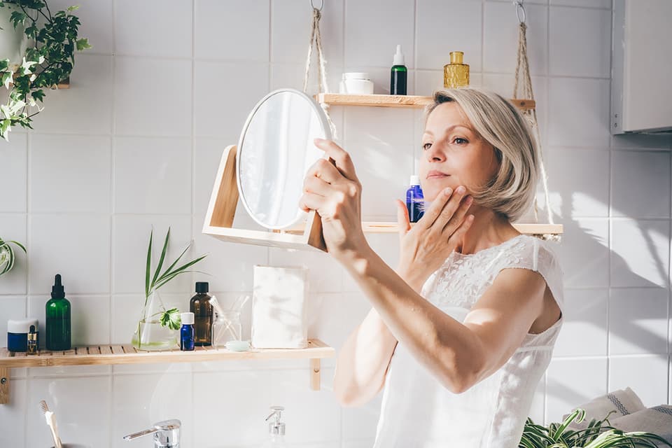 Woman looking in mirror