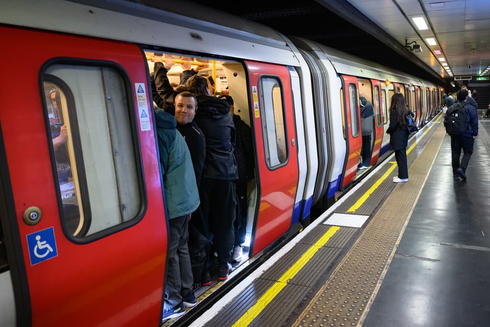 <p>Commuters squeeze into busy train carriages during strike action on April 21</p>