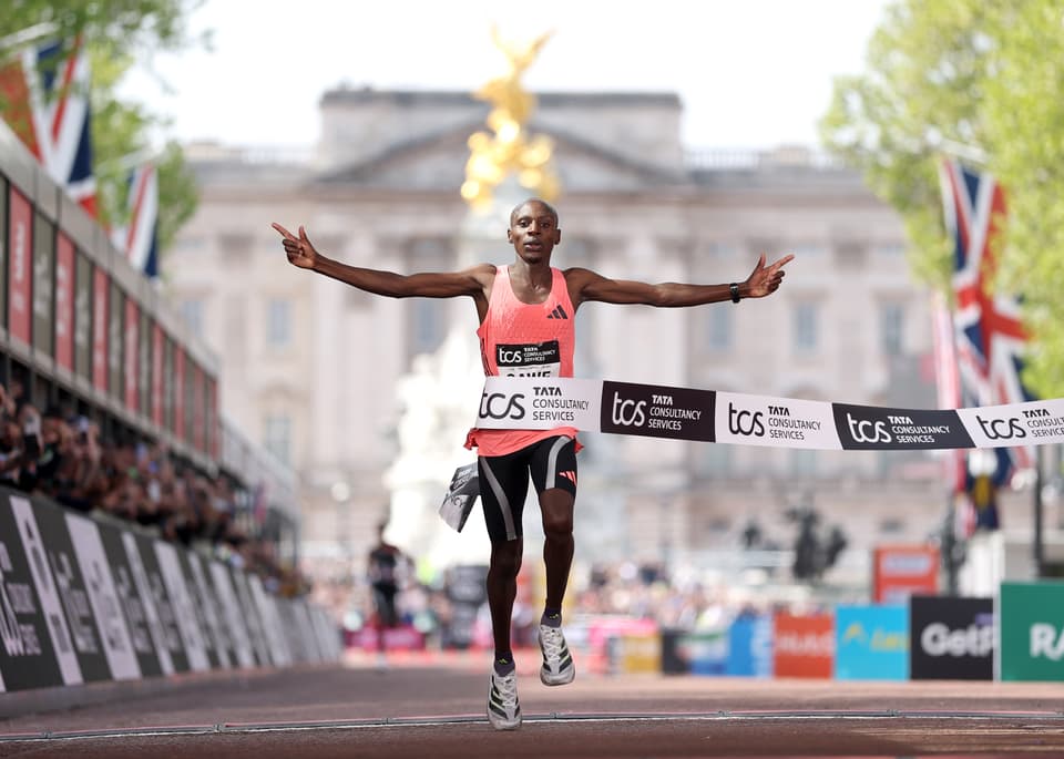 <p>Sabastian Sawe of Team Kenya celebrates crossing the line and winning with a new World Record </p>