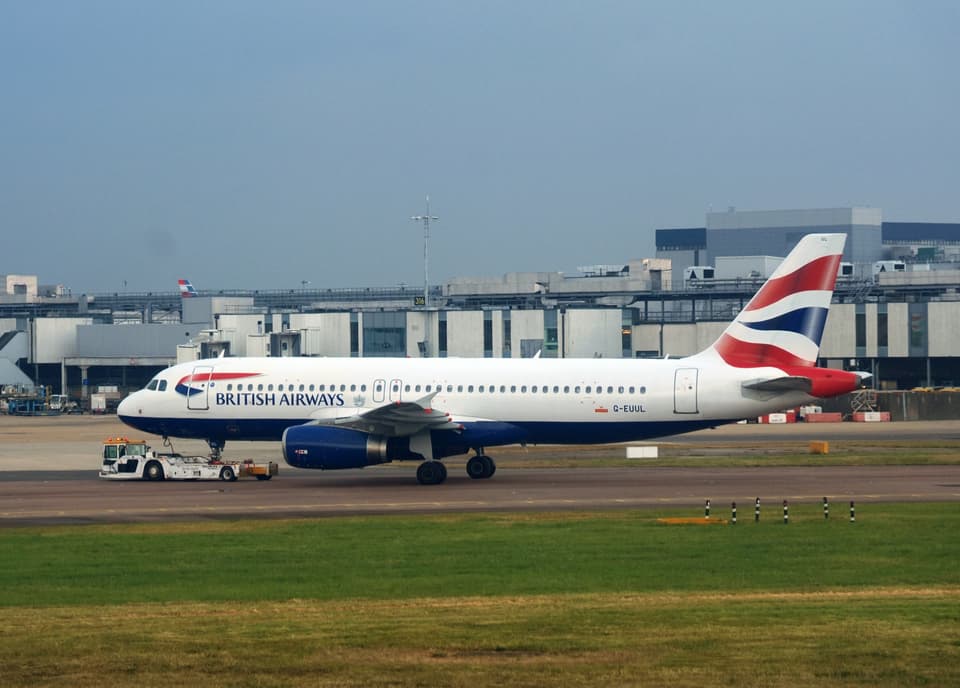 <p>A British Airways plane on the tarmac at Heathrow Airport Terminal 5, London</p>
