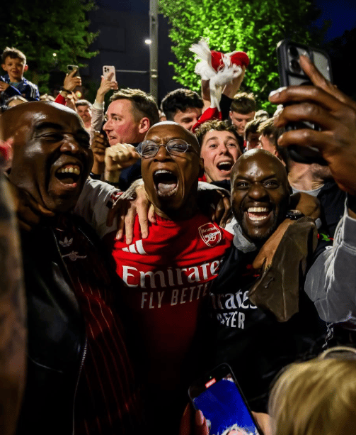 <p>Ian Wright celebrates Arsenal's title win outside Emirates Stadium</p>