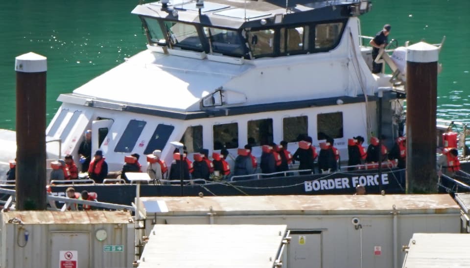 A group of people thought to be migrants are brought in to the Border Security Command compound in Dover, Kent, from a Border Security Command vessel following a small boat incident in the Channel. Picture date: Friday May 22, 2026.