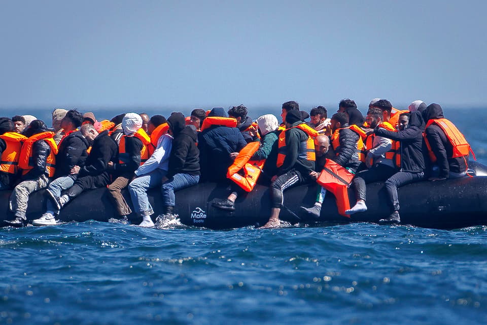 Migrants cross the English Channel from France in small boats