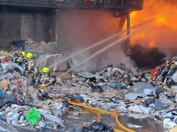 Firefighters tackle the blaze at the recycling centre
