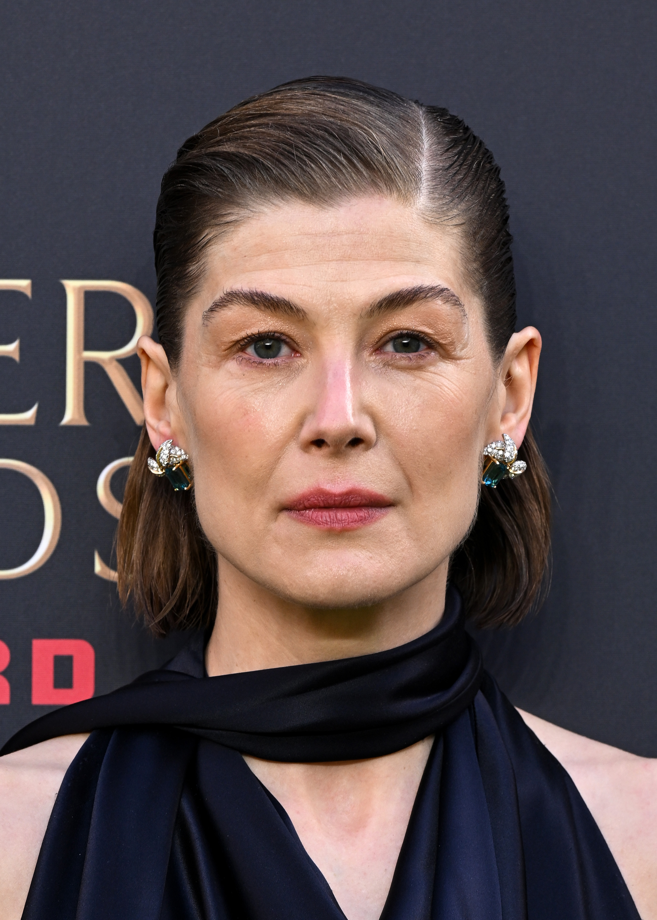 Rosamund Pike keeps her cool after phone alarm goes off during play