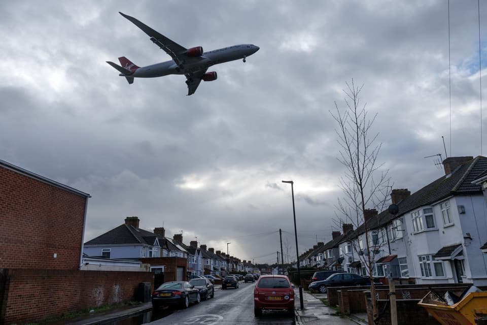 <p>LONDON, ENGLAND - JANUARY 28: Planes come into land at Heathrow airport over nearby housing on January 28, 2025 in London, England. A controversial plan to expand Heathrow airport with a third runway is expected to receive government support, as part of Chancellor Rachel Reeves' plans to boost growth in the economic sector. The expansion plans have long been met with opposition by environmental and local groups, citing issues such as carbon emissions and noise pollution, but proponents of the additional runway say the increased capacity would create jobs and benefit the UK economy overall. (Photo by Dan Kitwood/Getty Images)</p>
