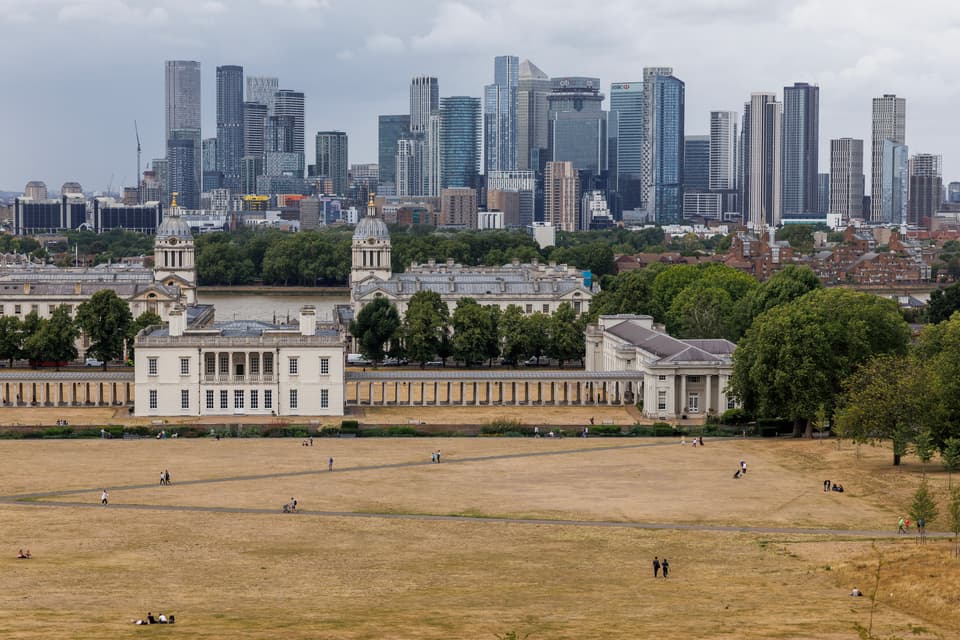<p>LONDON, ENGLAND - JULY 15: People walk through dried grass in Greenwich Park on July 15, 2025 in London, England. From the first day of meteorological summer on June 1st, the UK has experienced three heatwaves, and 2025 is shaping up to break further weather records. Spring was the UK's warmest and sunniest on record, and June became the warmest month on record for England. As the UK heads for its fourth heatwave later next week, hosepipe bans are coming into effect, and large grassed areas are parched. The UN body responsible for assessing climate change, the Intergovernmental Panel on Climate Change (IPCC), say it is "unequivocal that human influence has warmed the atmosphere, ocean and land." (Photo by Dan Kitwood/Getty Images)</p>