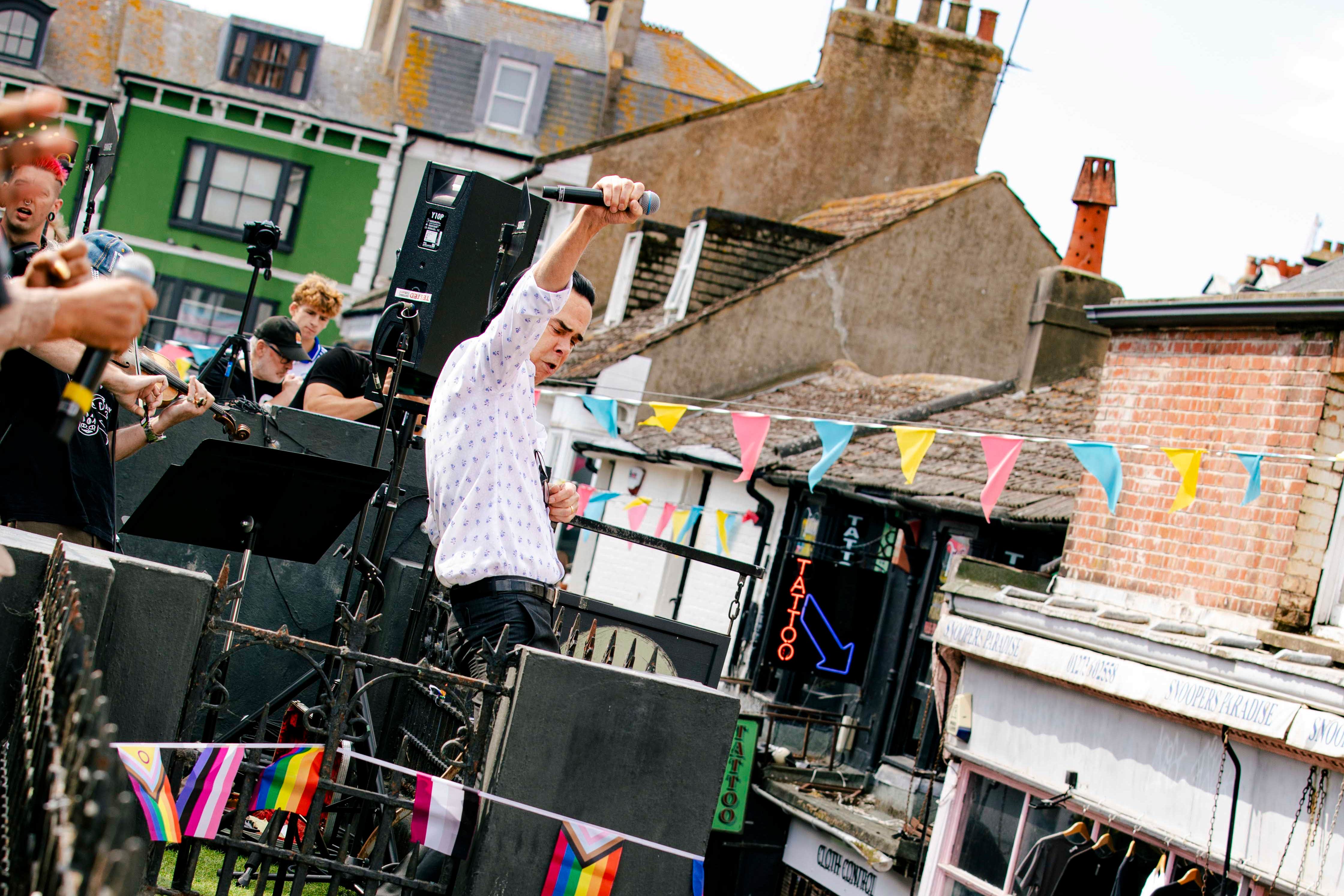 Nick Cave And The Bad Seeds perform surprise gig on roof of Brighton record shop