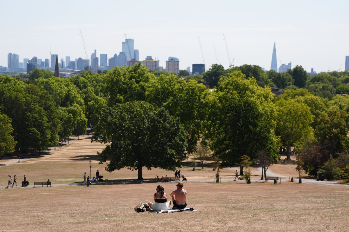 Temperatures rise above 30C while Scotland hit by half month’s rain in two days