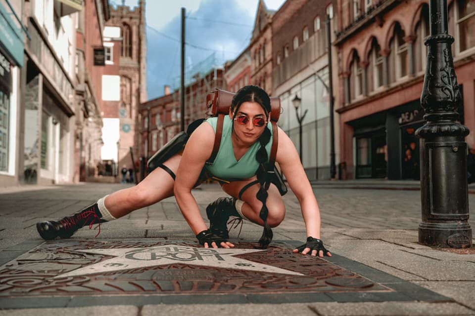 Woman in street dressed as Lara Croft from Tomb Raider