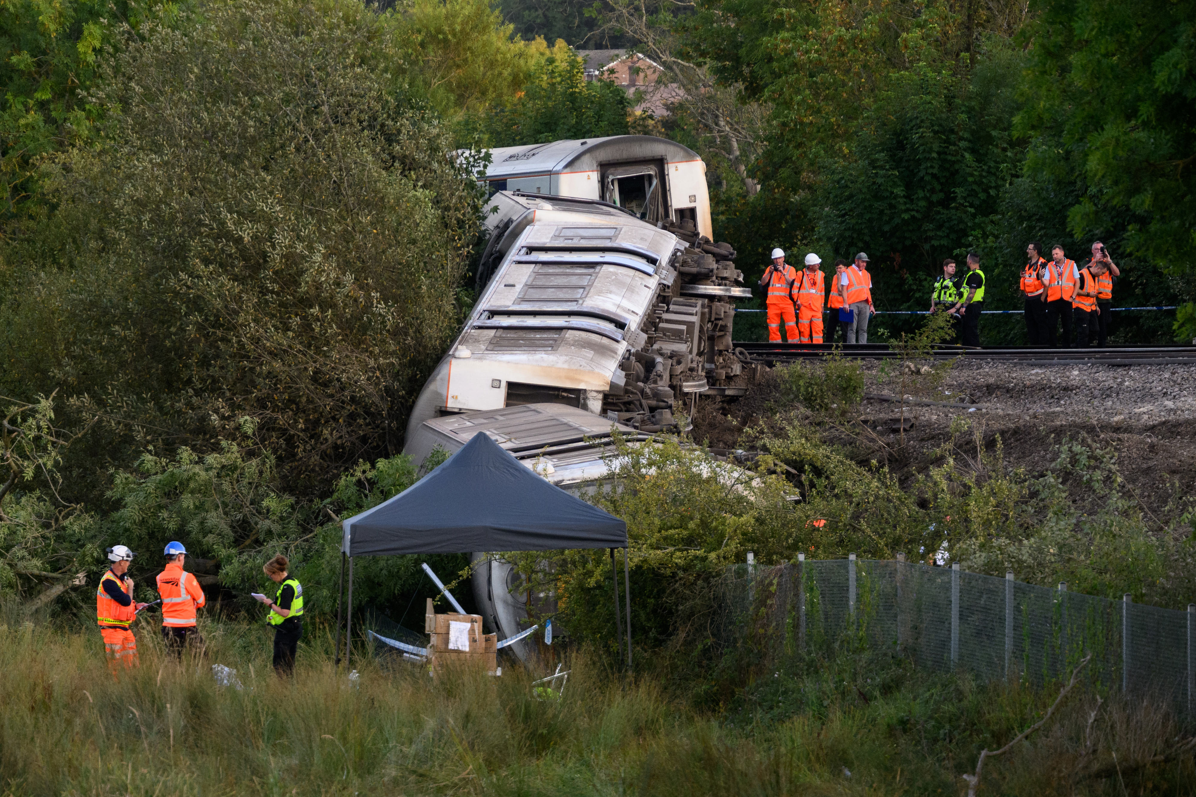 Derailed train causes travel chaos as London bus strike begins