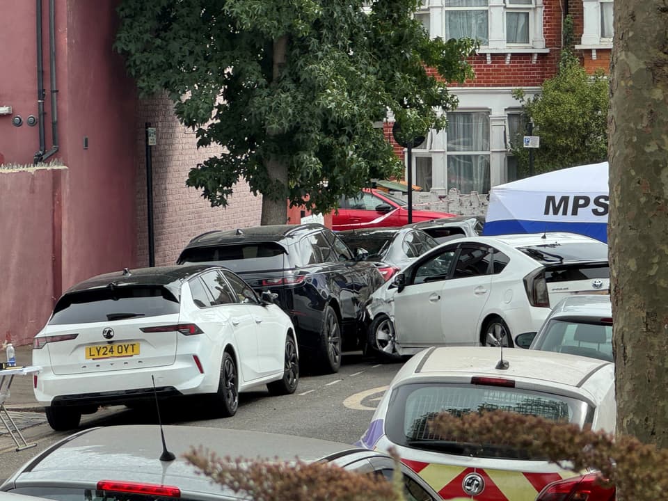 Handout photo of the scene on St Bartholomew's Road, Newham, east London, where a man in his 40s was found inside a vehicle with gunshot wounds and pronounced dead at the scene. Picture date: Tuesday August 18, 2026.