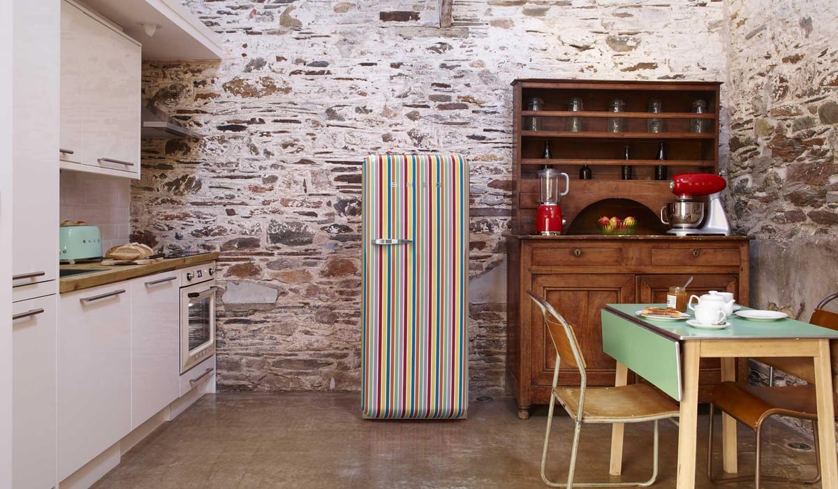 How to add a pop of colour to a kitchen: a bold and stylish fridge will instantly lift a neutral room | Homes and Property