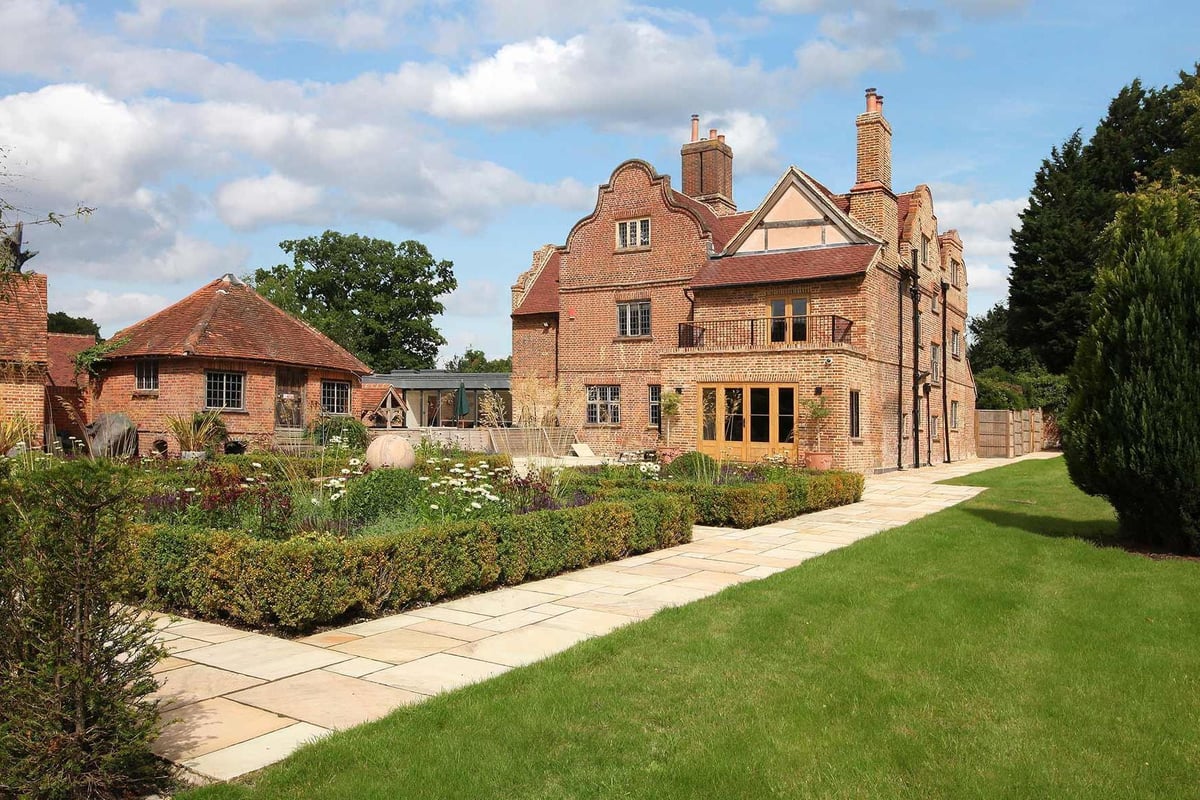 Art in residence: Grade II-listed manor in Surrey for sale with 17th-century carved panelling among in-built treasures | Homes and Property