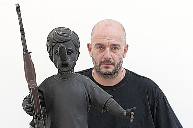 Artists grab AK-47s to bring world peace