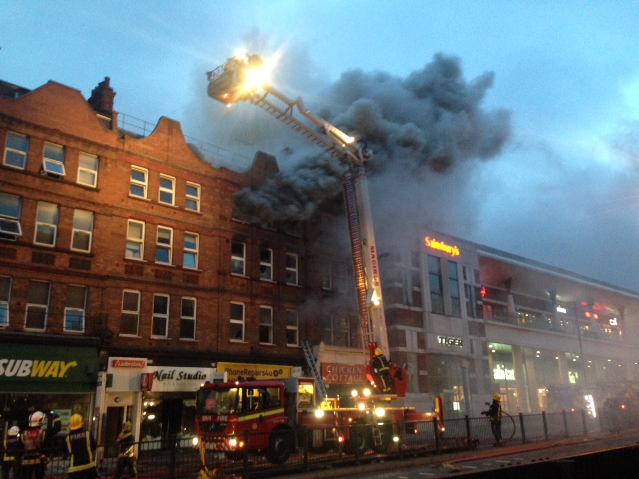 Dozens of firefighters continue to battle Finchley Road blaze
