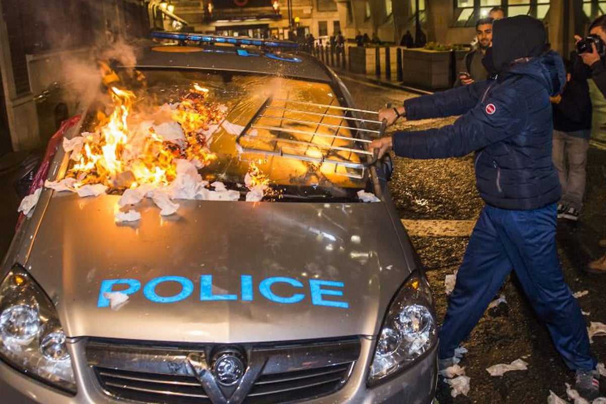 Million Mask March: protesters set fire to police car as scuffles break out at anti-capitalism demonstration | London Evening Standard