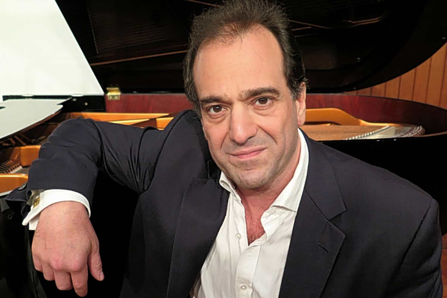 Pianist faces ban for sex assault on girl while kissing her mother