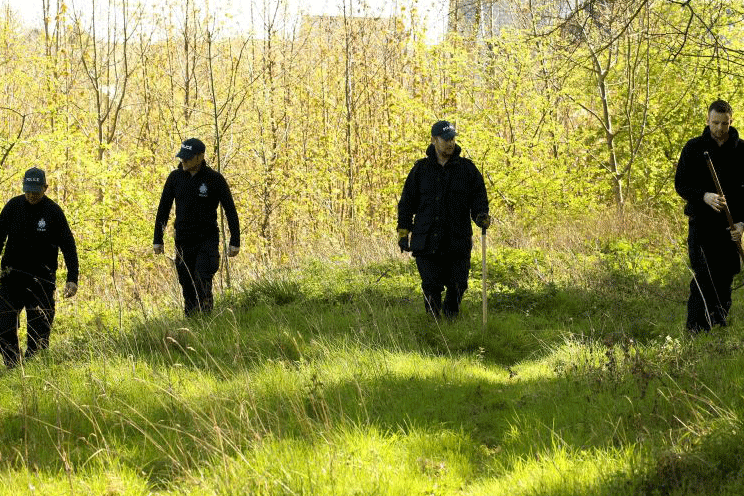 Police search woodland in hunt for missing children's author