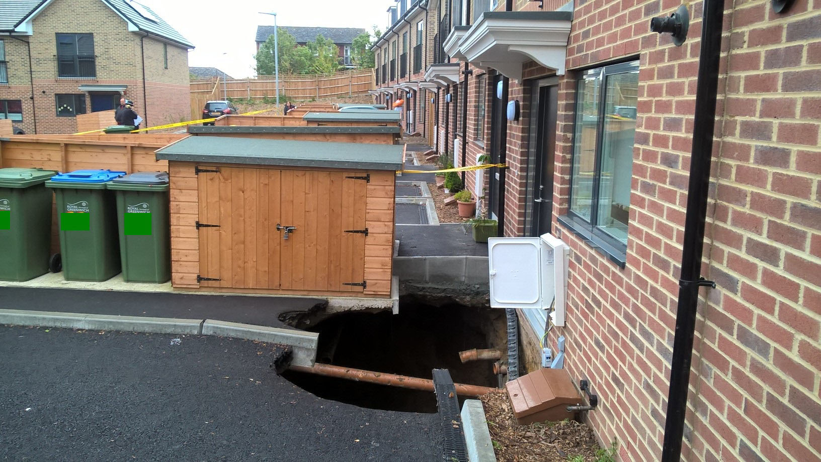 Sinkhole sixty feet deep opens up under homes in south-east London
