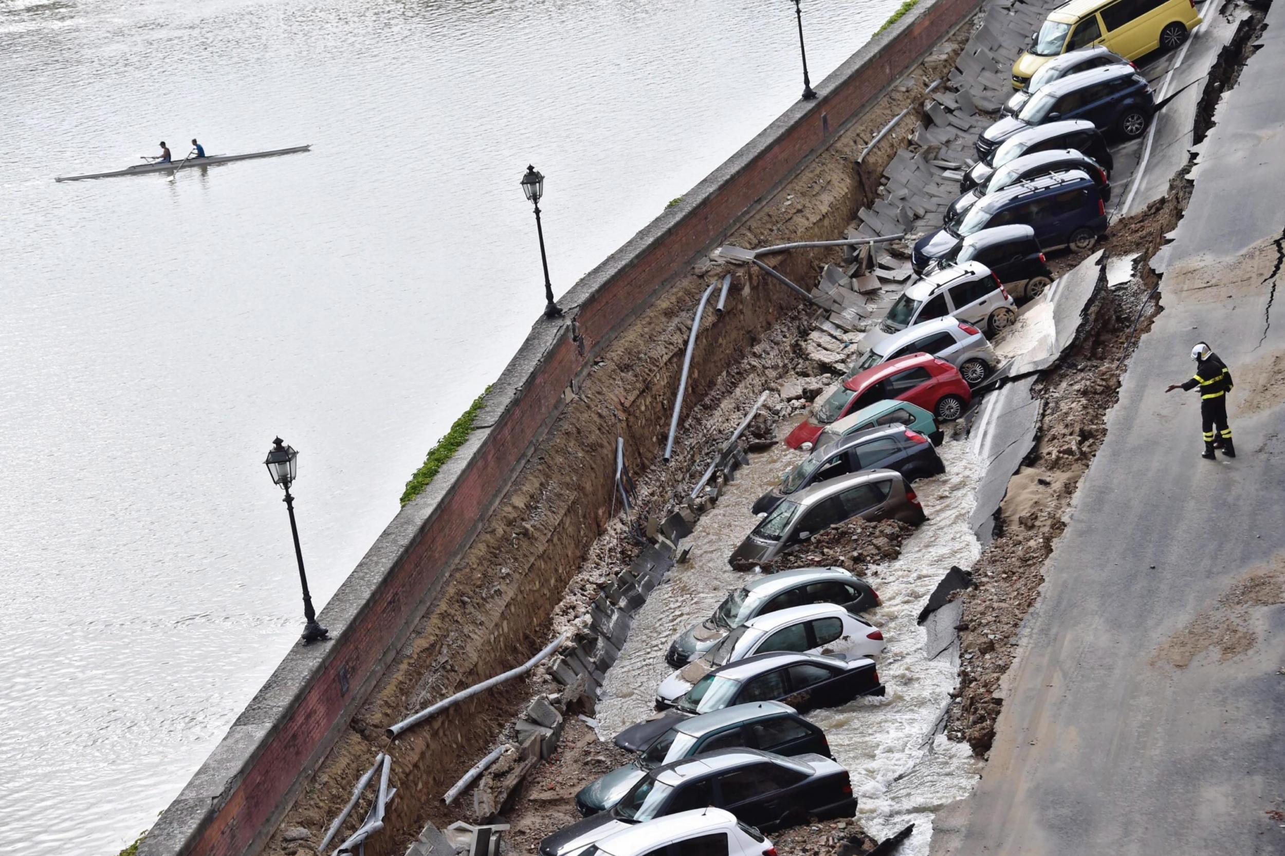 Dozens of cars swallowed by massive sinkhole in Florence