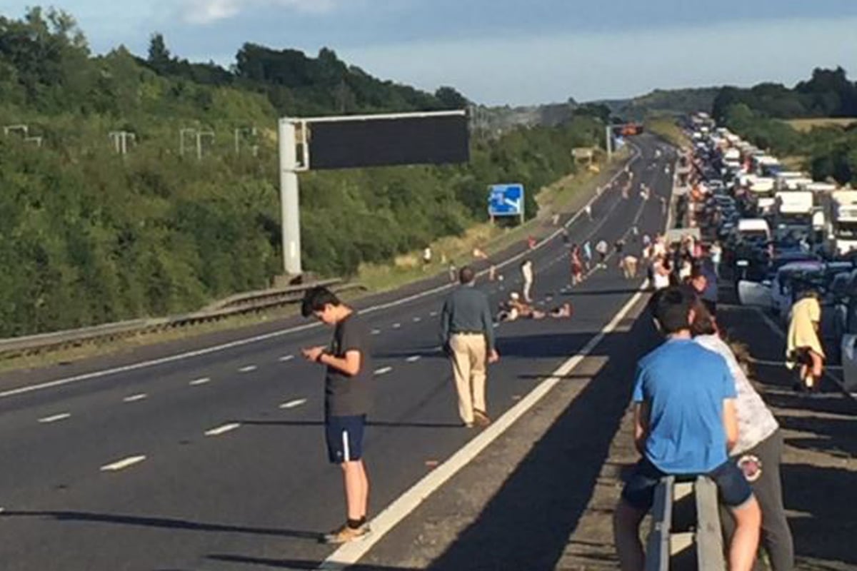 M20 motorists play football and sunbathe on blocked motorway after police incident | London Evening Standard