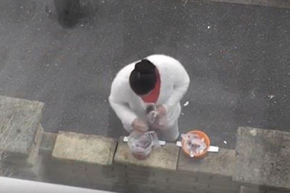Woman takes sweets left out for children after Halloween | London Evening Standard