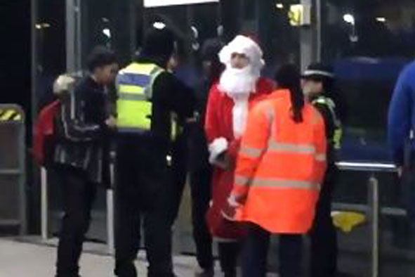 Bizarre moment police confront Father Christmas on Tube platform | London Evening Standard