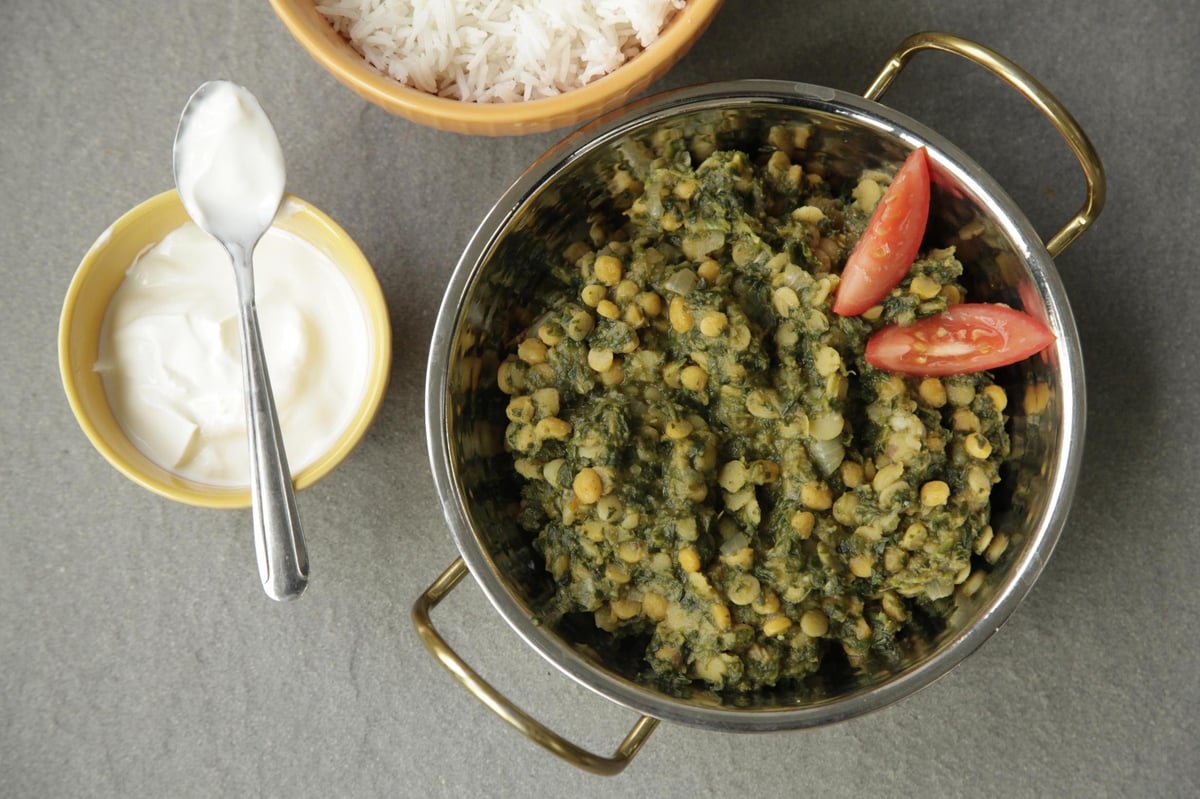 How to make Mallika Basu's spicy dal with spinach, tomato and onion | London Evening Standard